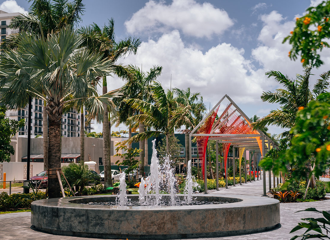 Doral, FL - View of a Fountain Surrounded by Palm Trees in Downtown Doral Florida on Sunny Afternoon