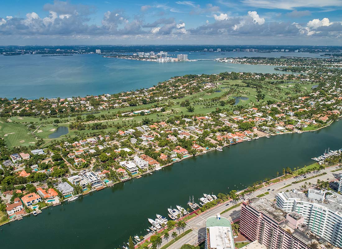 Upper East Side, FL - Scenic View of Waterfront Homes on an Island in the Upper East Side of Miami Florida on a Beautiful Sunny Day